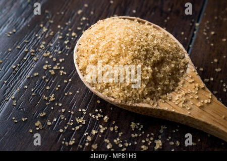 Brown Sugar in Wooden Spoon with Package. Organic Food. Stock Photo