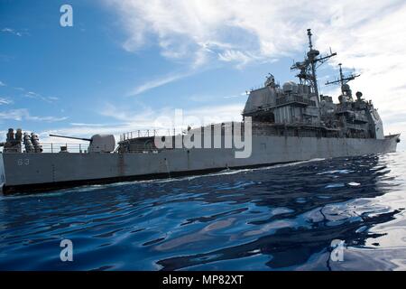 The U.S. Navy Ticonderoga-class guided-missile cruiser USS Cowpens steams underway September 12, 2012 in the Pacific Ocean.  (photo by Paul Kelly via Planetpix) Stock Photo