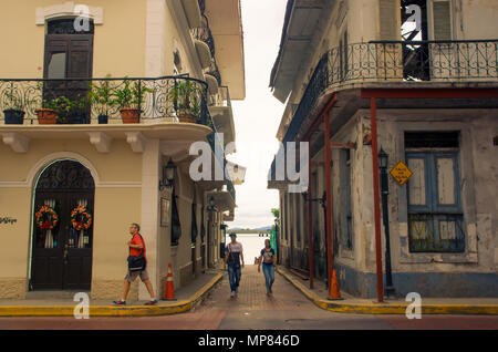 PANAMA CITY, PANAMA - APRIL 20, 2018: Unidentified people walking in a small alley in Casco Viejo a historical colonial center of Panama City. Cityscape - old town Stock Photo