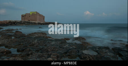 Famous Paphos medieval Castle close to the fishing harbor of Paphos late in the evening Stock Photo