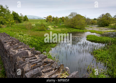 The Great Glasshouse at the National Botanic Garden of Wales viewed from across a lake Stock Photo