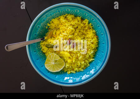 Lemon rice in colorful ceramic bowl Stock Photo