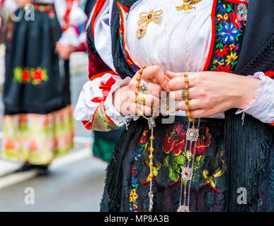 the famous Festival of Sant Efisio in Sardinia. Close up of wearing rosary during the religious procession - Cagliari town - Italy Stock Photo
