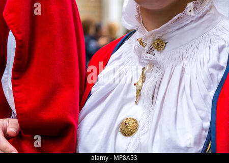 CAGLIARI, Italy - May 1, 2018: The famous Festival of Sant Efisio in Sardinia. Close up of wearing necklace during the religious procession Stock Photo