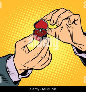 man opens a box with wedding ring Stock Vector