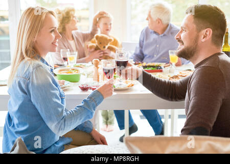 Happy Couple at Family Dinner Stock Photo