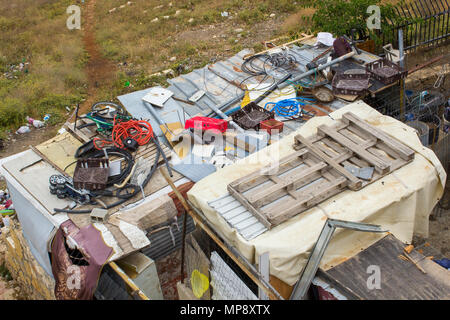 Waste thoughtlessly piled upon rooftops  of Arab homes in the city of Jerusalem and clearly visible to tourists from the rooftop of the historic Herod Stock Photo