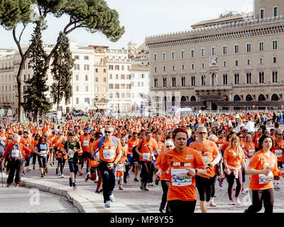 Rome, Italy - April 8, 2018: group of runners men and women running in piazza in Rome Marathon and Run for Fun Stock Photo