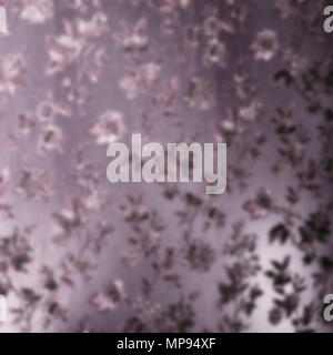 purple satin fabric with traditional printed flowers in the blur Stock Photo
