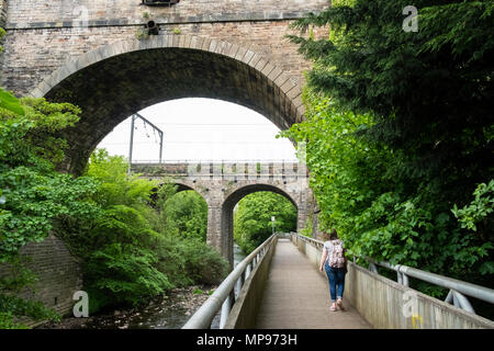 View of Water of Leith Walkway as it passes below aqueduct carrying the Union canal in Edinburgh, Scotland, United Kingdom, UK Stock Photo