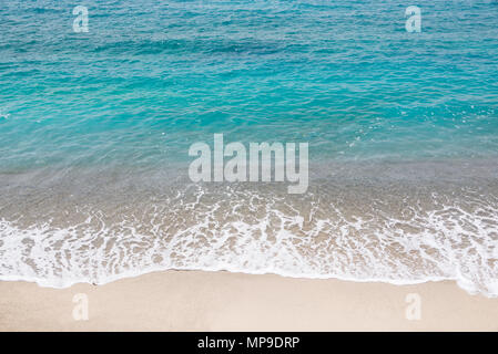 Top view of a beach, blue ocean waves, sand and water Stock Photo