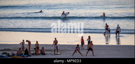 People enjoying a swim as the sun sets over Cable Beach, Broome, WA, Australia. Stock Photo