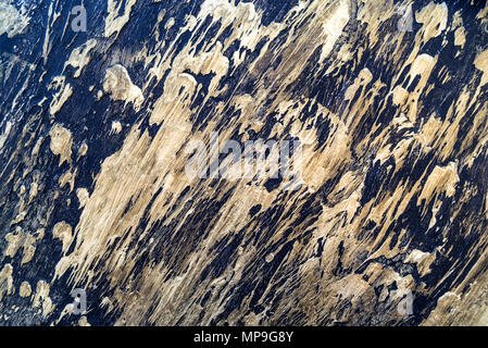 Abstract background of beige smears on dark Stock Photo
