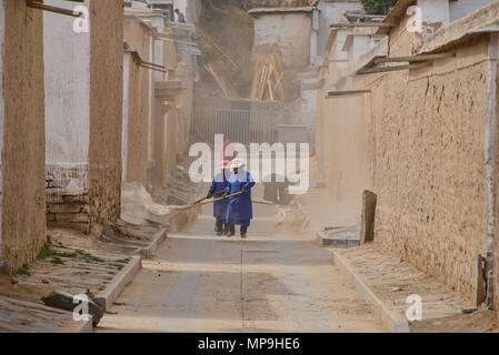 Workers in Labrang Monastery, Xiahe, Gansu, China Stock Photo