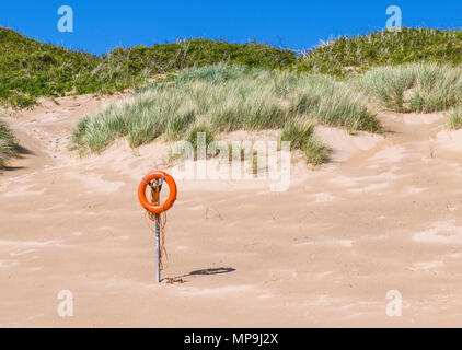 Lifebelt on Broad Haven South Beach in South Pembrokeshire, Wales Stock Photo