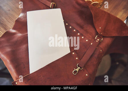 Brown leather apron protection for welder Stock Photo