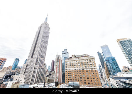 New York City, USA - April 7, 2018: Cityscape skyline of midtown NY with empire state building during day famous iconic building in NYC Herald Square, Stock Photo