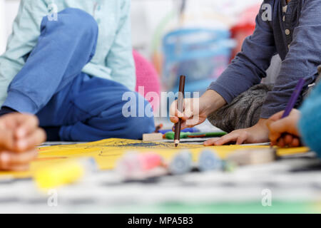 Close-up of group of kids drawing the picture during classes Stock Photo