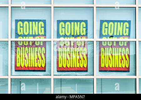 Closeup Of Red And Yellow Store Closing Banner Poster Sign On
