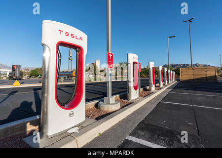Primm, Nevada, USA - May 16, 2018:  Row of Tesla electric vehicle charging stations near Interstate 15 between Los Angeles and Las Vegas. Stock Photo