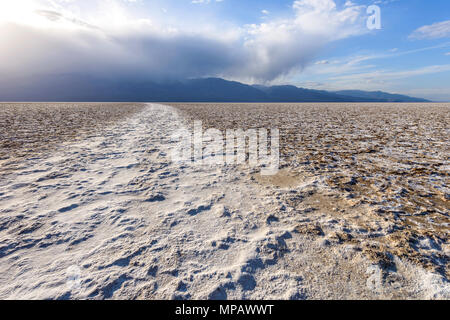 Salt Flats - A spring evening view of salt crusts, in interesting shapes and patterns, expanding over vast salt flats at Death Valley National Park. Stock Photo