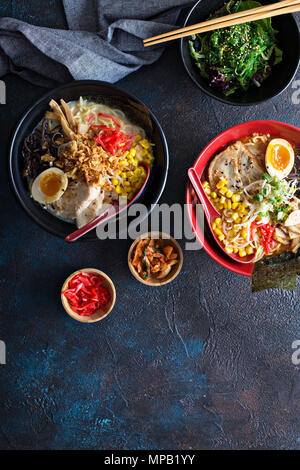 Spicy ramen bowls with noodles, pork and chicken Stock Photo