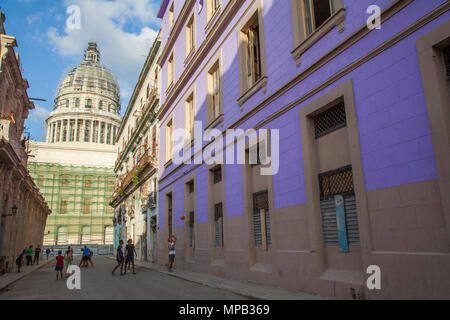 Local cuban children playing soccer and basketball in the streets of Old Havana Cuba with Capital building in background Stock Photo