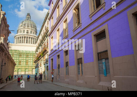 Local cuban children playing soccer and basketball in the streets of Old Havana Cuba with Capital building in background Stock Photo
