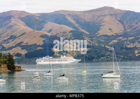 Cruise ship Crown Princess anchored in Akaroa Bay, New Zealand Stock Photo