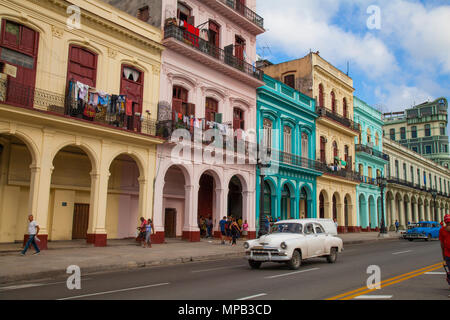 Classic 1950s cars driving down main street in Old Havana Cuba near the Capital building Stock Photo