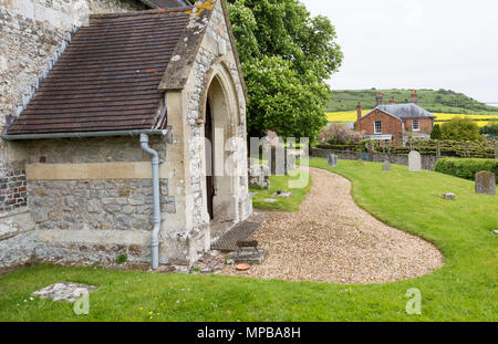 Huish church farmhouse and chalk scarp slope, Manor Farm, Huish, Vale of Pewsey, Wiltshire, England, UK Stock Photo