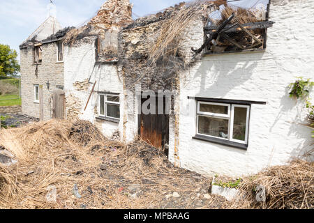 Burnt out thatched cottage in Piddlehinton, Dorset, Britain, UK Stock ...