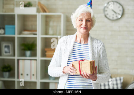 Happy Senior Lady Celebrating Birthday Stock Photo