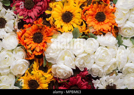 Reusable artificial flowers made from cloth and plastic. Stock Photo
