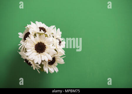 Reusable artificial flowers made from cloth and plastic. Stock Photo
