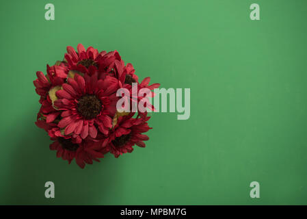 Reusable artificial flowers made from cloth and plastic. Stock Photo