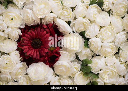 Reusable artificial flowers made from cloth and plastic. Stock Photo