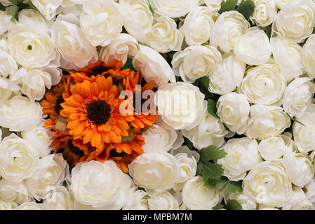 Reusable artificial flowers made from cloth and plastic. Stock Photo