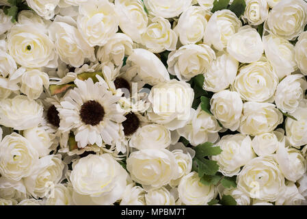 Reusable artificial flowers made from cloth and plastic. Stock Photo