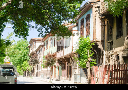 Beautiful old street in downtown with houses with wooden shutters in the classic Turkish Ottoman style, Turkey, center of Afyonkarahisar The two-story Stock Photo