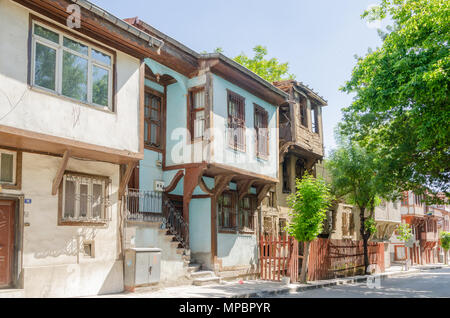 Beautiful old street in downtown with houses with wooden shutters in the classic Turkish Ottoman style, Turkey, center of Afyonkarahisar The two-story Stock Photo