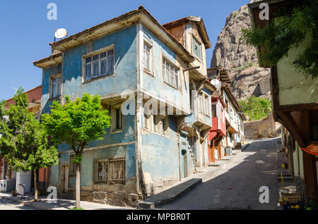 Beautiful old street in downtown with houses with wooden shutters in the classic Turkish Ottoman style, Turkey, center of Afyonkarahisar The two-story Stock Photo