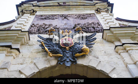 Two-headed eagle, a symbol of Russia, on the ancient wall of the church, a horizontal photo. Saint-Petersburg, Russia. 18 September 2016 Stock Photo