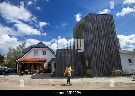 27 April 2018, Germany, Trinwillershagen: The Salzreich's salt tower clad in wood. With its three-story salt tower and the six-metre high graduation tower, the Salzreich offers salt therapies, singing bowl massages, and healing applications for the upper respiratory tract, and provides information on everything salt-related. A total of 35 tons of salt blocks from Pakistan were processed over the course of the past few years. Photo: Jens Büttner/dpa-Zentralbild/ZB Stock Photo