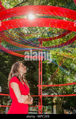 London, UK. 22nd May, 2018. Scale Rule in St. James' Churchyard a pavilion designed GCSE students from around London. It responded to the theme of sustainability by proposing a sensitive metaphor: layers representing past, present and future creates a kaleidoscopic oculus - Outdoor installations for Clerkenwell Design Week, which starts today. Credit: Guy Bell/Alamy Live News Stock Photo
