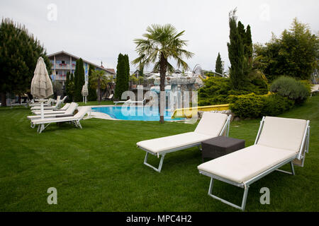 22 May 2018, Italy, Eppan: Deckchairs and a pool in the garden of the hotel complex of the team hotel 'Weinegg'. The German soccer national team will prepare for the World Cup 2018 in Russia at their training camp near Bozen from 23 May to 07 June 2018. Photo: Christian Charisius/dpa Stock Photo