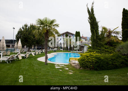 22 May 2018, Italy, Eppan: Deckchairs and a pool in the garden of the team hotel 'Weinegg'. The German soccer national team will prepare for the World Cup 2018 in Russia at their training camp near Bozen from 23 May to 07 June 2018. Photo: Christian Charisius/dpa Stock Photo