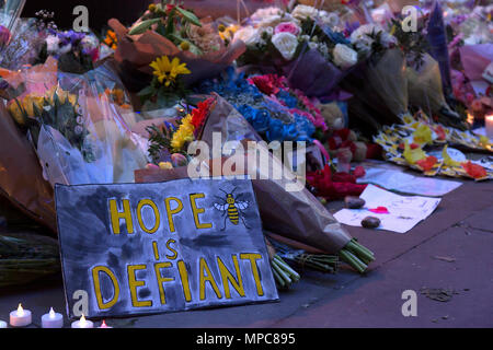 Manchester, UK. 22nd May, 2018. Floral tributes and signs in St. Ann's Square in the center of Manchester, to remember the 22 victims of the bombing of the Manchester Arena, following the conceret given by the American singer Ariana Grande. Credit: Rob Carter/Alamy Live News Stock Photo