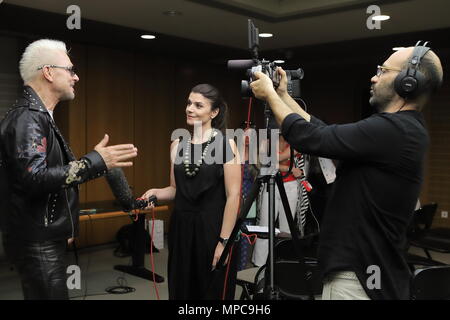 Athens, Greece. 22nd May, 2018. Rudolf Schenker (L), lead guitarist and founding member of the German rock band Scorpions, receives an interview with Xinhua at Athens Concert Hall Megaron in Athens, Greece, on May 22, 2018. Scorpions will present their 'Once in a lifetime' show along with the Athens State Orchestra at the Panathenaic Stadium of Athens on July 16. Credit: Chris Kissadjekian/Xinhua/Alamy Live News Stock Photo