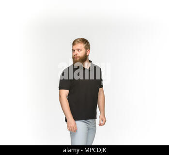 Closeup of young man's body in empty black t-shirt isolated on white background. Mock up for disign concept Stock Photo
